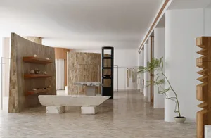Minimalist retail store with concrete, wooden, and stone elements.