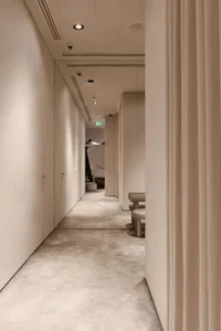 A modern corridor with concrete flooring and walls