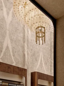 Modern storefront with marble walls, wooden shelves, and crystal chandeliers