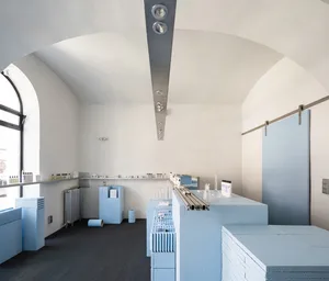 A minimalist storefront with a concrete facade, featuring a modern design.