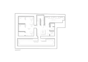 Floor plan of a minimalist office space featuring neutral colors and a sleek design.