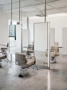 Modern salon interior featuring metallic styling and furniture