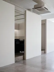 A modern office space featuring a concrete floor.
