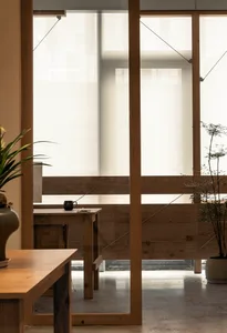 Minimalist interior design featuring wood elements.