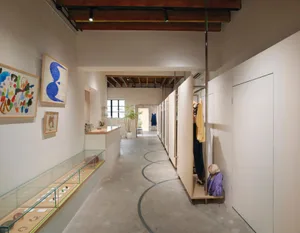 A retail storefront featuring a concrete floor and display case.