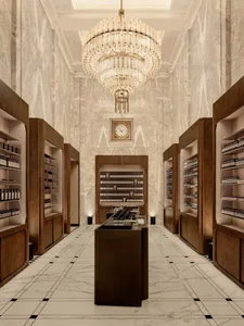 Luxurious retail store with marble walls and wood shelves