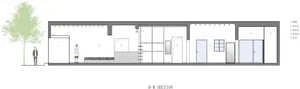 Cross-sectional view of a modern storefront with a concrete facade and a glass door.