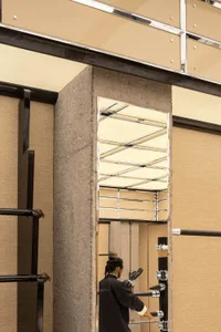 A minimalist storefront with concrete finishes and modern design elements.