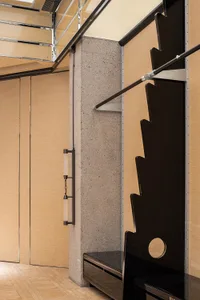 Modern closet featuring concrete and wooden elements.