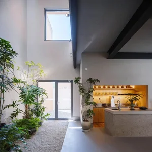 Modern interior space with concrete and wooden elements.
