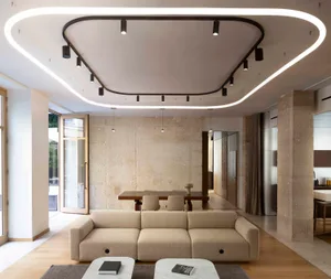 A modern living room featuring a beige cheesecloth sofa, minimalist design, and sleek lighting