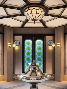 Modern lobby with glass doors and concrete columns