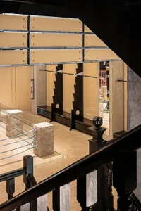 An image showcasing a modern retail showroom with concrete walls and floors.