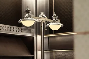 Modern retail storefront featuring urban-industrial design elements with prominent metallic and lighting fixtures.