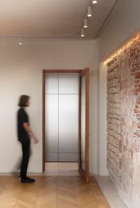 Minimalist interior design featuring concrete and wooden elements.