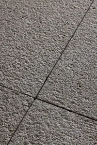 Concrete floor tiles arranged in a modern pattern for aesthetic and functional purposes.