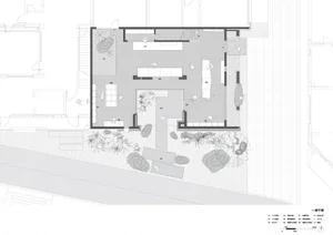 A detailed architectural floor plan featuring a modern industrial office space with concrete floors, brick walls, and large g