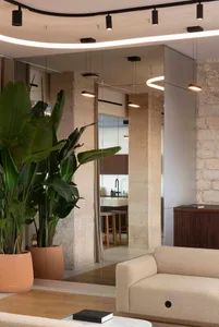 Modern living room featuring concrete walls and a minimalist design.