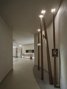 A modern living room featuring wooden furniture and decor.