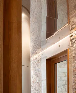 A modern storefront with concrete walls and a sleek, minimalist design.