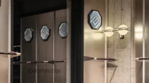 Modern retail storefront with metallic geometric elements.