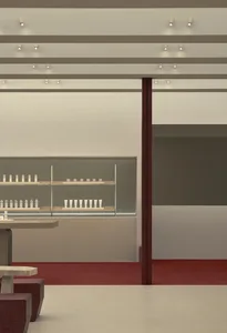 A modern retail storefront with a glass display case showcasing products.