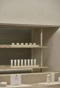A modern retail storefront with concrete finishes.