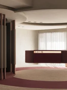 A minimalist office reception desk made of red leather in a modern, well-lit interior.