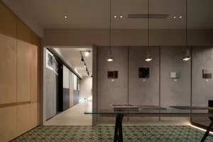 A spacious showroom featuring a modern design with concrete and cement elements.