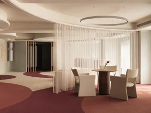 Modern, neutral-toned restaurant interior with minimalist seating arrangement and elegant decor.