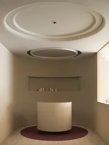 A minimalist bathroom with a luxurious porcelain bathtub and modern design elements.