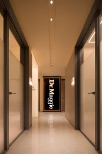 Modern interior corridor with white marble flooring and glass walls