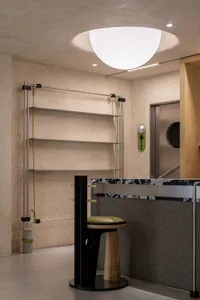 Modern interior design featuring cork and metal materials.