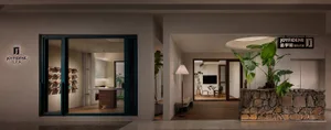 Modern showroom with metal frame and green plant decorations