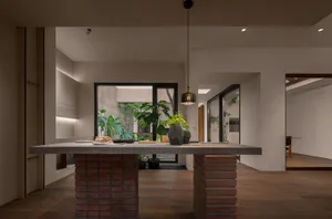 A modern kitchen with a concrete countertop.