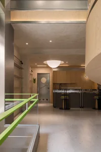 Modern, minimalist kitchen interior with wood finishes and clean lines.