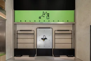 A modern retail storefront with black and glass elements