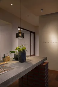 Modern retail storefront featuring concrete and brick materials