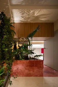 A modern retail storefront with a marble facade.
