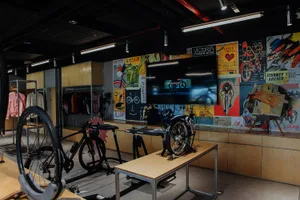 Retail store interior design featuring wooden elements and bicycles