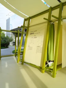 Image showcasing a modern furniture design made of wood with a cat peeking out.
