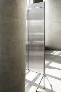 Modern metal floor screen in an industrial indoor setting