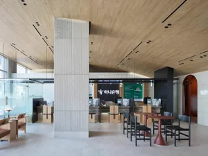 A modern office space featuring concrete and wood materials.