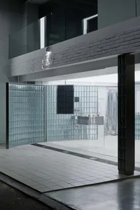 Modern spa interior with glass walls and minimalist design elements.