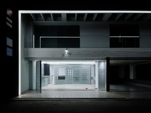 Modern storefront with glass walls and a minimalist design.