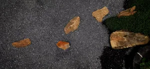 Scattered stones on a gravel ground