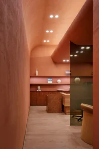 Modern interior design featuring a lobby with terrazzo and cement elements.