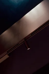 A sleek metallic counter with a linear light fixture.