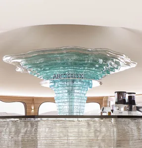 A modern storefront with a glass countertop featuring an 'ARC'TERYX' logo.