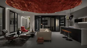 A modern living room with metallic accents and a large, floating red rock-like ceiling ornament.
